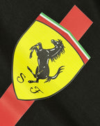 Closeup of F1 Black Unisex regular fit T-shirt by Turn 1 Brand, an F1 Apparel brand of India. Charles Leclerc fan tshirt with Front print features Ferrari logo and Charles Leclerc signature.
