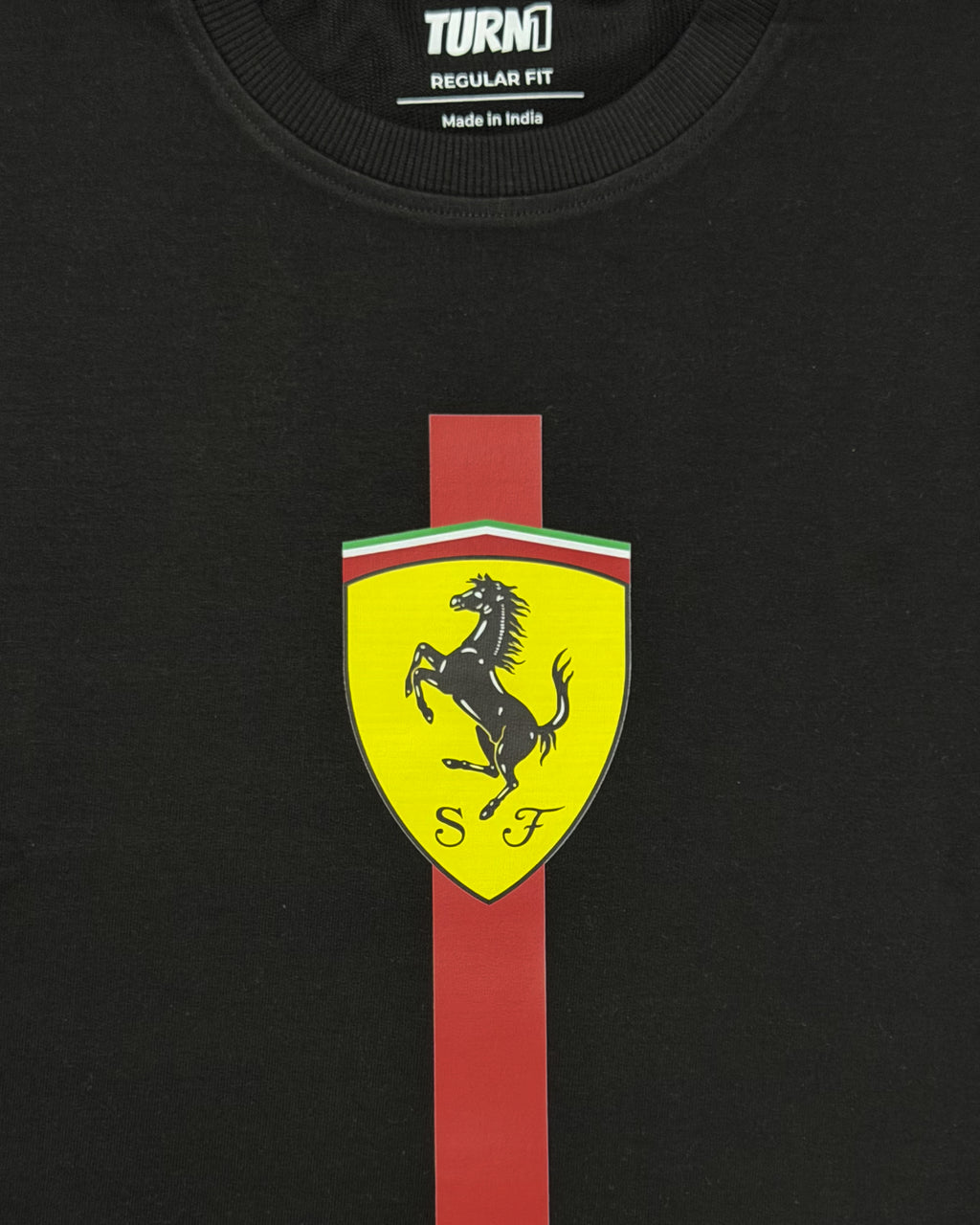 Closeup of F1 Black Unisex regular fit T-shirt by Turn 1 Brand, an F1 Apparel brand of India. Charles Leclerc fan tshirt with Front print features Ferrari logo and Charles Leclerc signature.