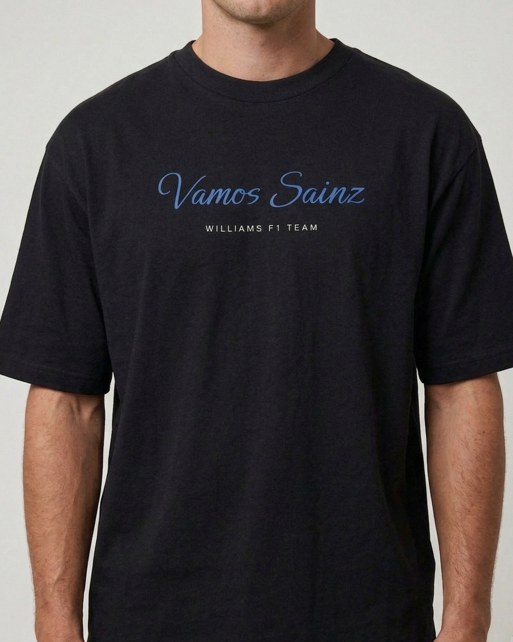 Male Model wearing F1 Turn1 India Black oversized unisex tshirt - fan graphic of Carlos Sainz Smooth Operator, Williams F1 raacing team driver and featuring his Car Number 55.
front print - Vamos Sainz