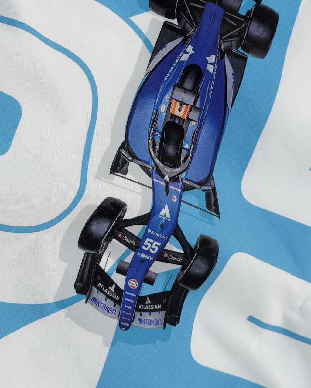 Close up of F1 Turn1 India Off White oversized unisex tshirt - fan graphic of Carlos Sainz Smooth Operator, Williams F1 racing team driver and featuring his Car Number 55.