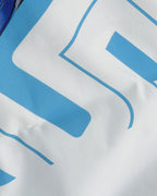 Close up of F1 Turn1 India Off White oversized unisex tshirt - fan graphic of Carlos Sainz Smooth Operator, Williams F1 racing team driver and featuring his Car Number 55.