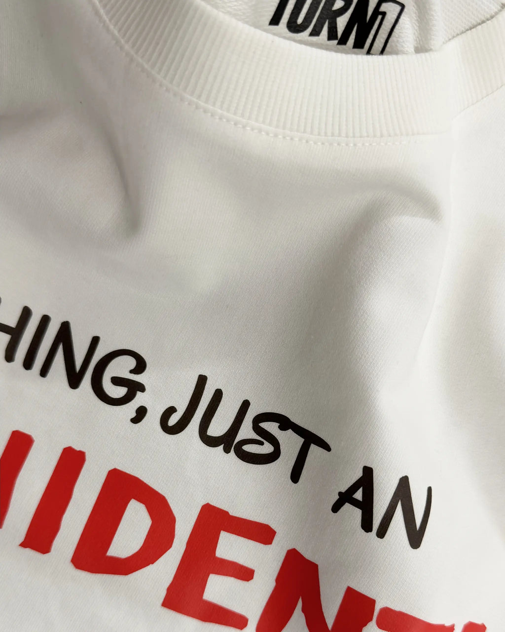 Close-up Image of Fabric and Print - Charles Leclerc Just an Inchident F1 Unisex Oversized T-shirt Off-White Front View | Turn1 India