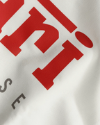 Close-up Image of Fabric and Print - Lewis Hamilton Ferrari 44 Still We Rise F1 Unisex Oversized Fan Graphic T-shirt Off-White | Turn1 India
