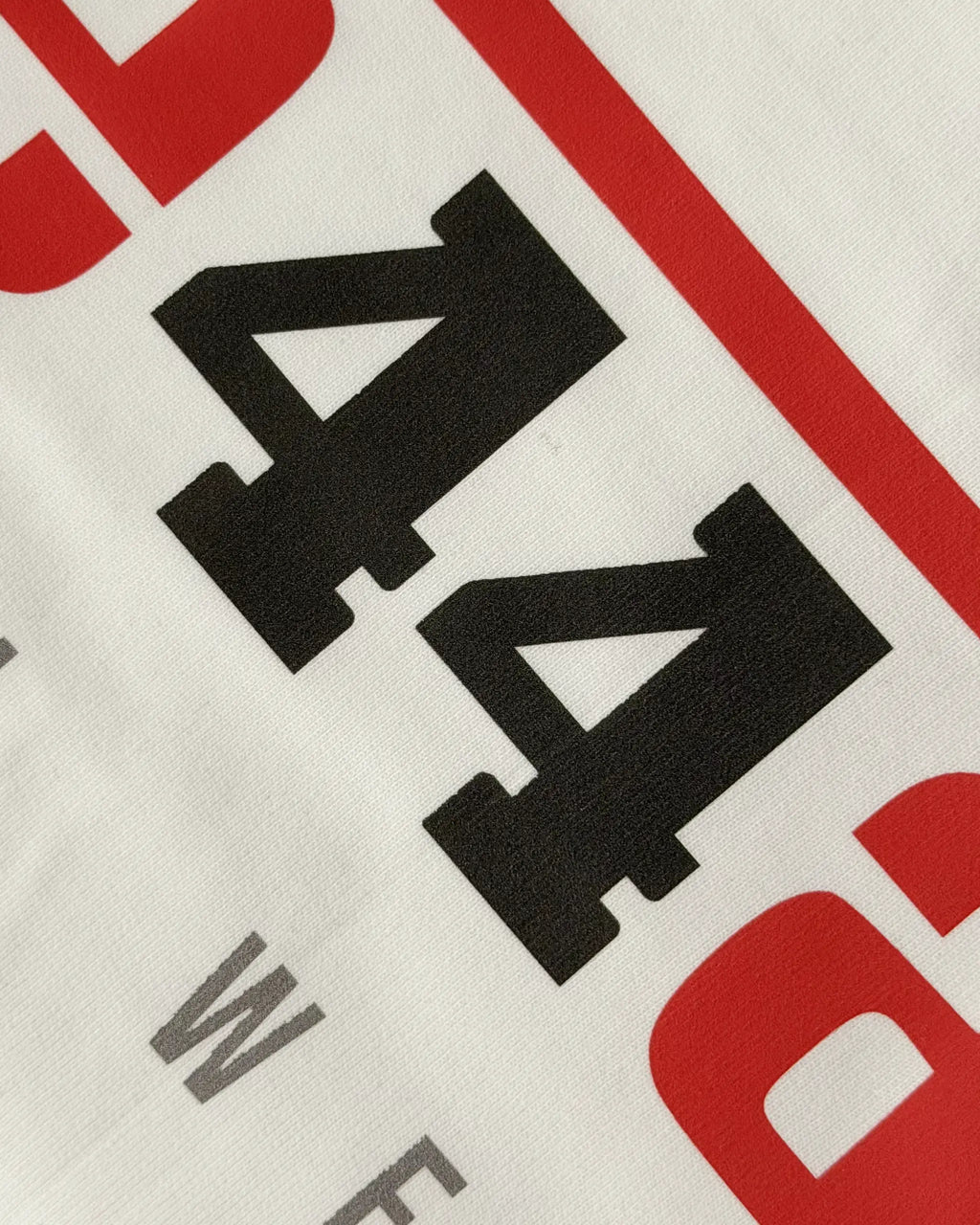 Close-up Image of Fabric and Print - Lewis Hamilton Ferrari 44 Still We Rise F1 Unisex Oversized Fan Graphic T-shirt Off-White | Turn1 India
