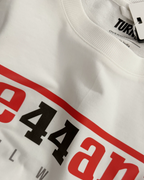 Close-up Image of Fabric and Print - Lewis Hamilton Ferrari 44 Still We Rise F1 Unisex Oversized Fan Graphic T-shirt Off-White | Turn1 India