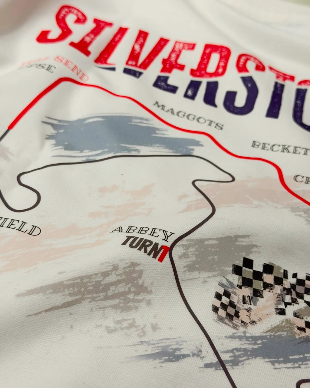 Close-up of Fabric and Print - British Grand Prix Circuit Silverstone F1 Unisex Oversized T-shirt Off-White | Turn1 India