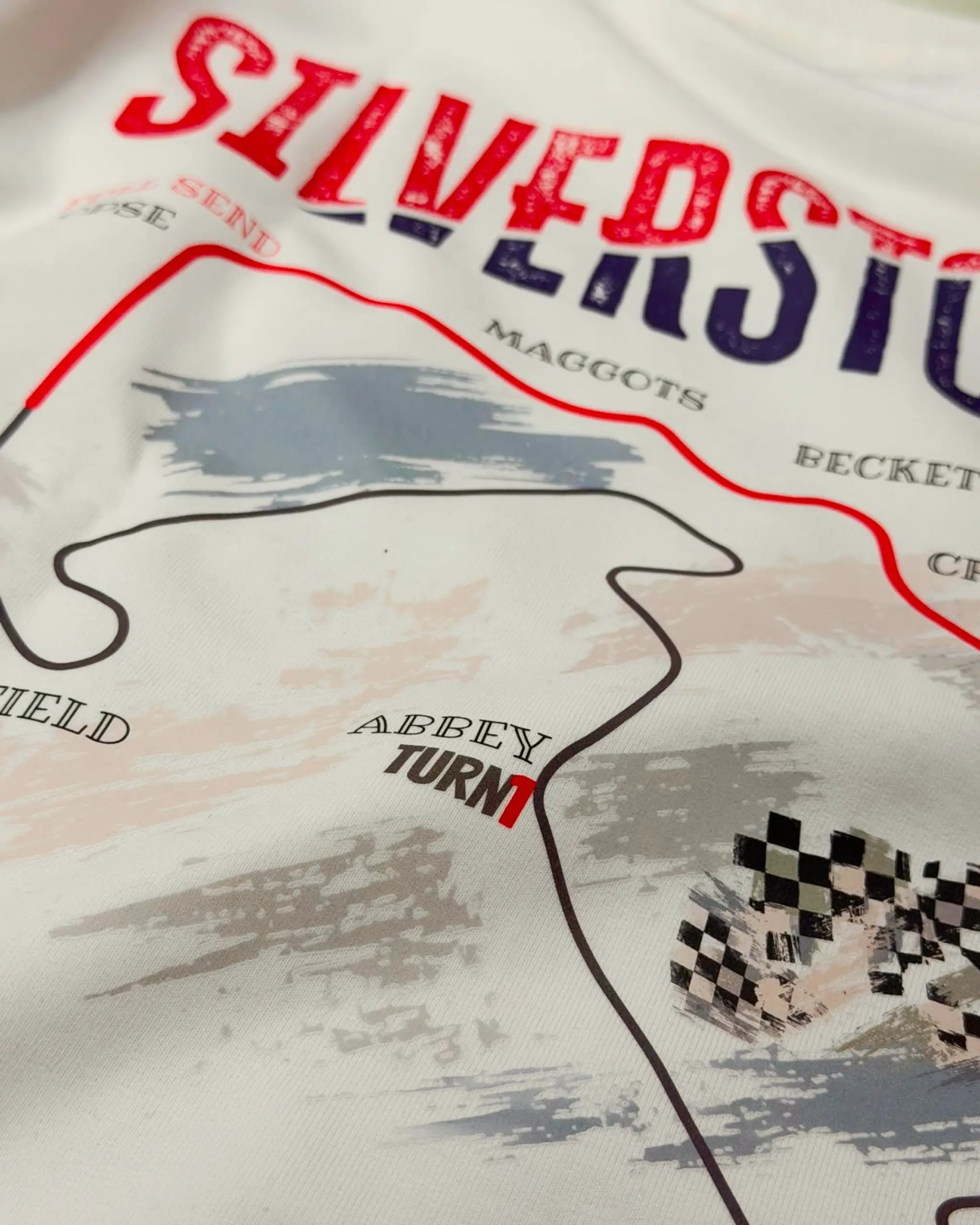 Close-up of Fabric and Print - British Grand Prix Circuit Silverstone F1 Unisex Oversized T-shirt Off-White | Turn1 India