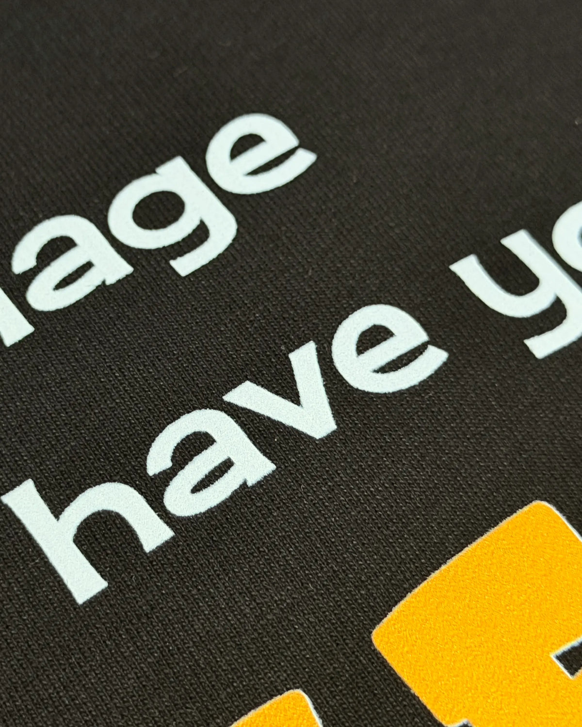 Close-up of Fabric and Print - Lando Norris Champion Talent F1 Graphic T-shirt Black Front View | Turn1 India
