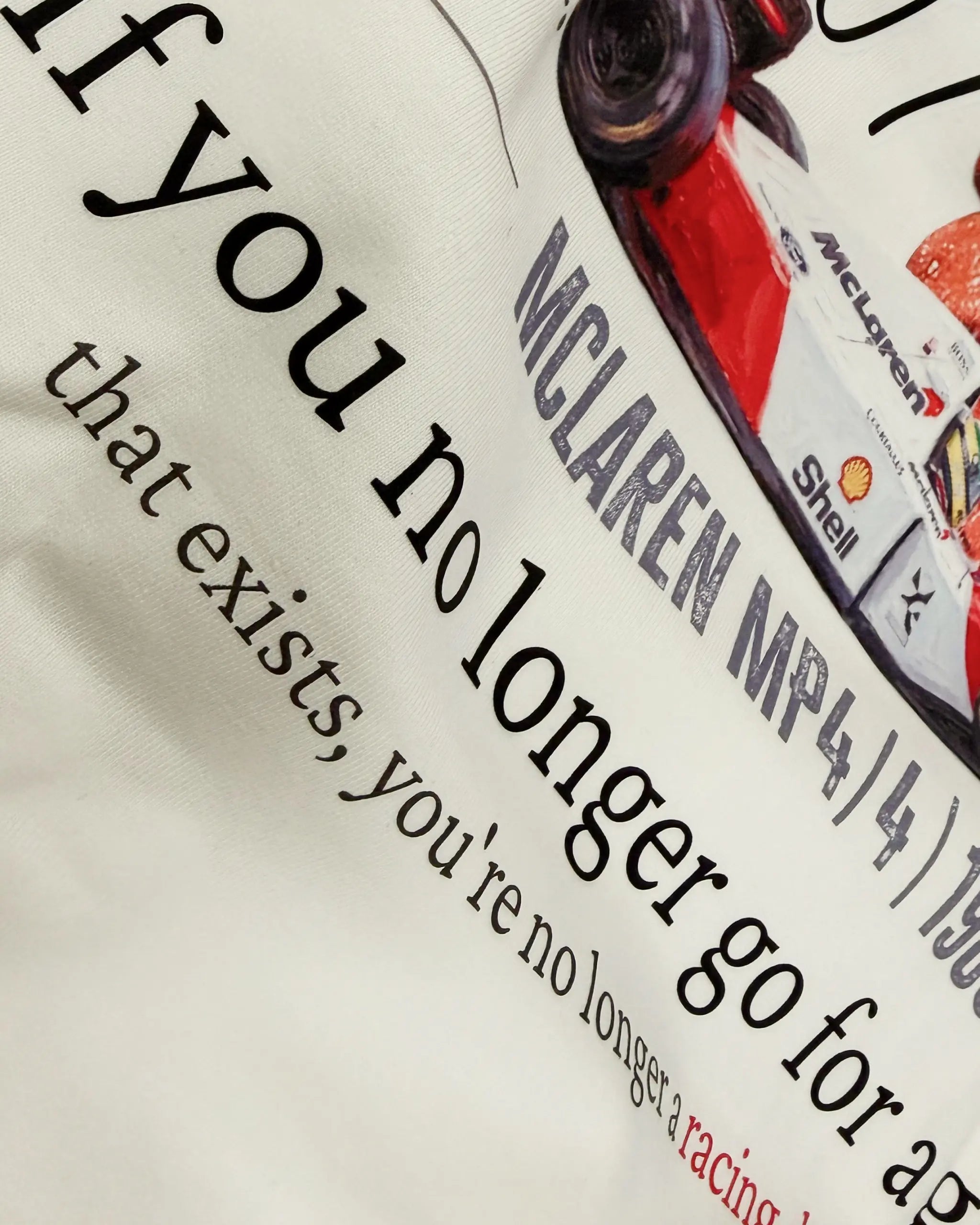 Close-up of Fabric and Print - Ayrton Senna McLaren Legacy F1 Unisex Oversized T-shirt Off-White Front View | Turn1 India