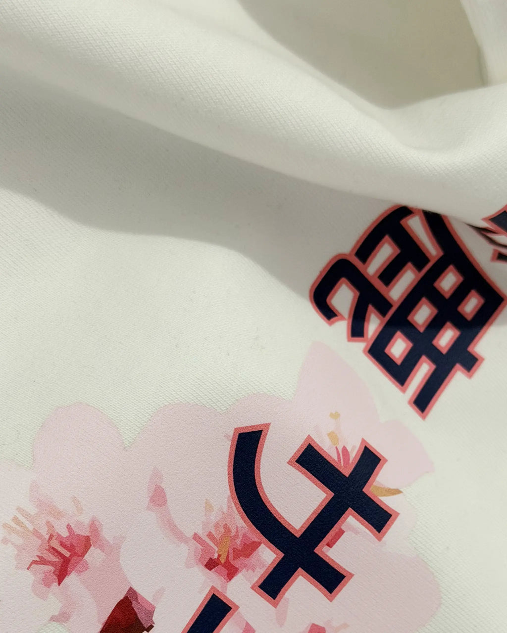 Closeup image of fabric and print | Suzuka Circuit Japan Grand Prix F1 Unisex Oversized Graphic T-shirt Off-White Side View | Turn1 India