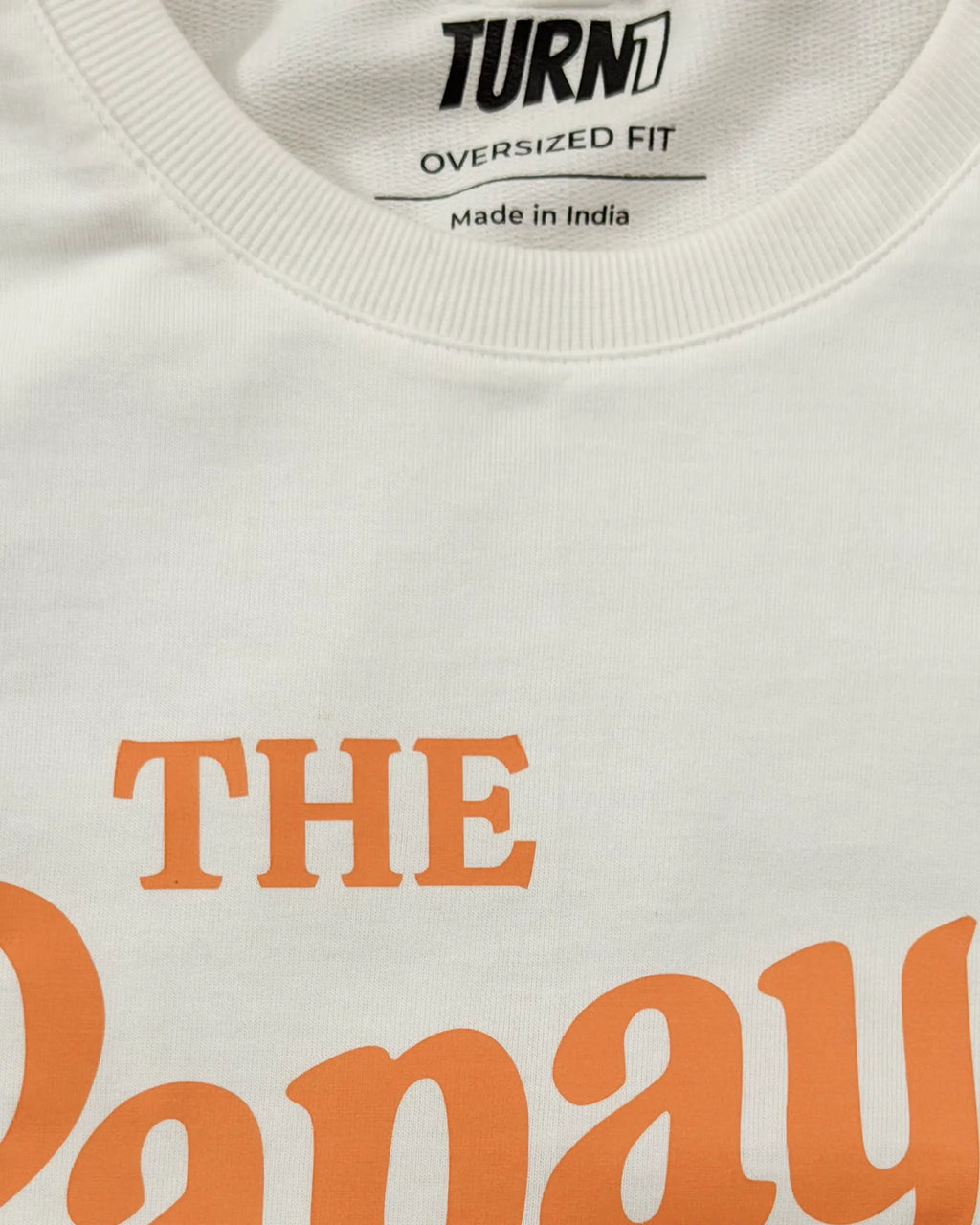 Closeup image of fabric and print Papaya Club McLaren F1 Unisex Oversized T-shirt Off-White Front View | Turn1 India