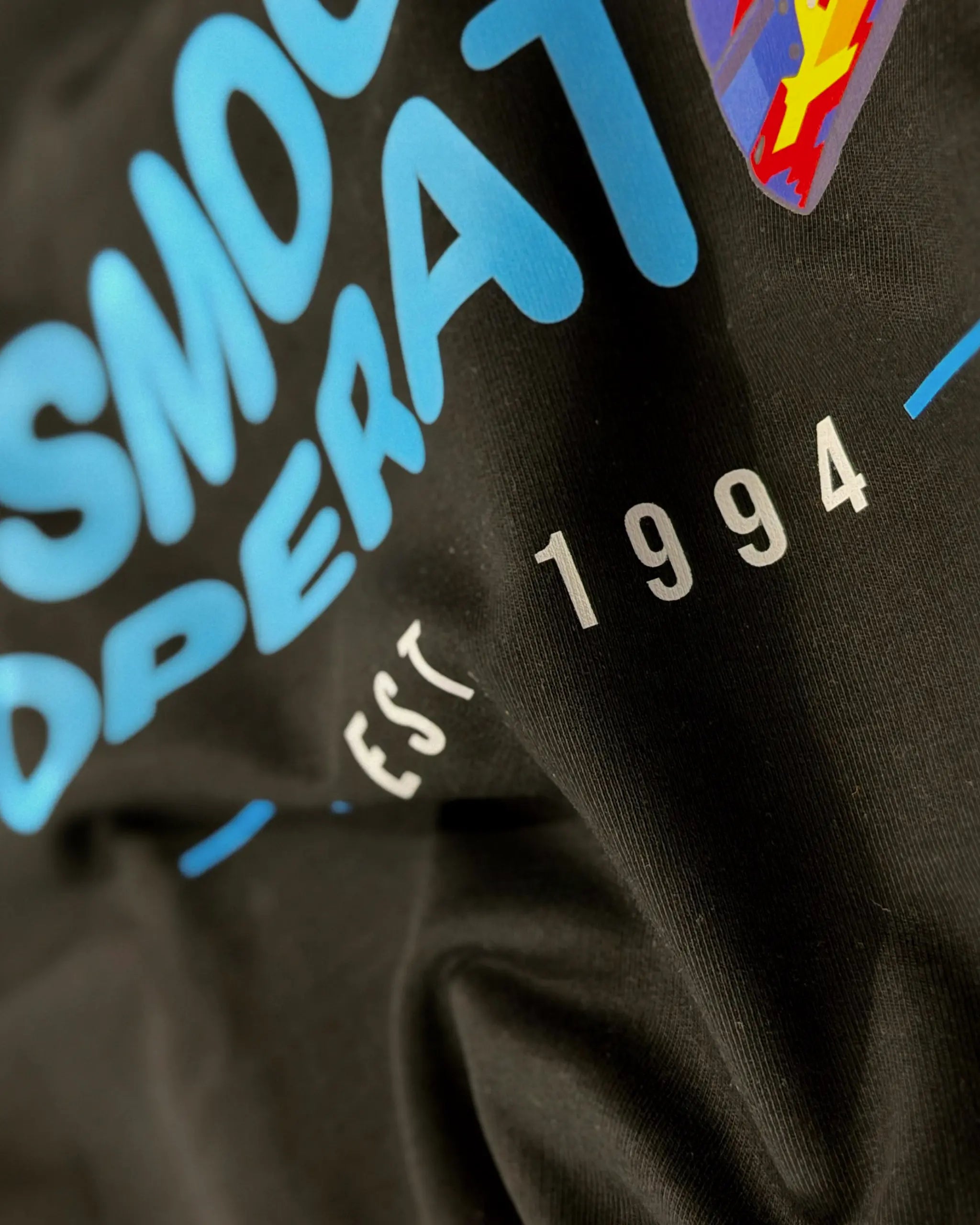 Closeup of Fabric and Print - Carlos Sainz Smooth Operator F1 Unisex Oversized T-shirt Black | Turn1 India