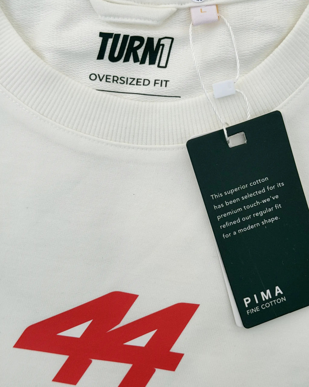Closeup view of Lewis Hamilton Remember Who You Are Quote F1 Unisex Oversized T-shirt Off-White | Turn1 India
