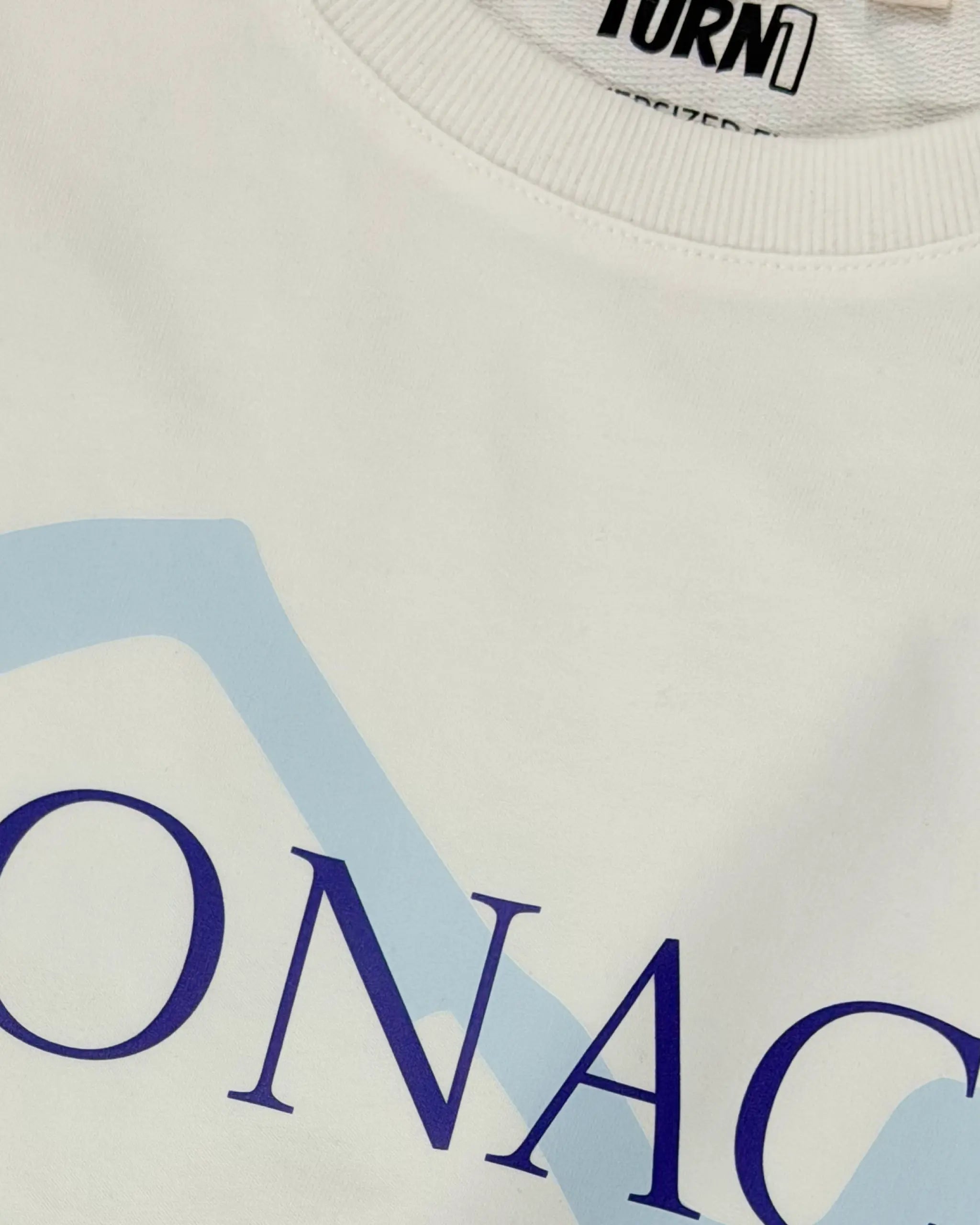 Closeup picture of Monaco Grand Prix Circuit F1 Unisex Oversized T-shirt Off-White Front View Print and Fabric | Turn1 India