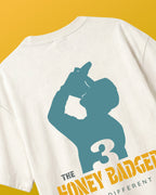 F1 Turn1 India Off White Oversized Unisex Tshirt featuring fan graphic Danial Riccardio, ex driver for Redbull Racing F1 team and Mclaren Racing team. Tshirt features "shoey" moment of Daniel Riccardio and his nickname "Honey Badger" in text.