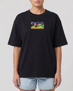 Female Model Wearing Ayrton Senna McLaren Legacy F1 Unisex Oversized T-shirt Black Front View | Turn1 India