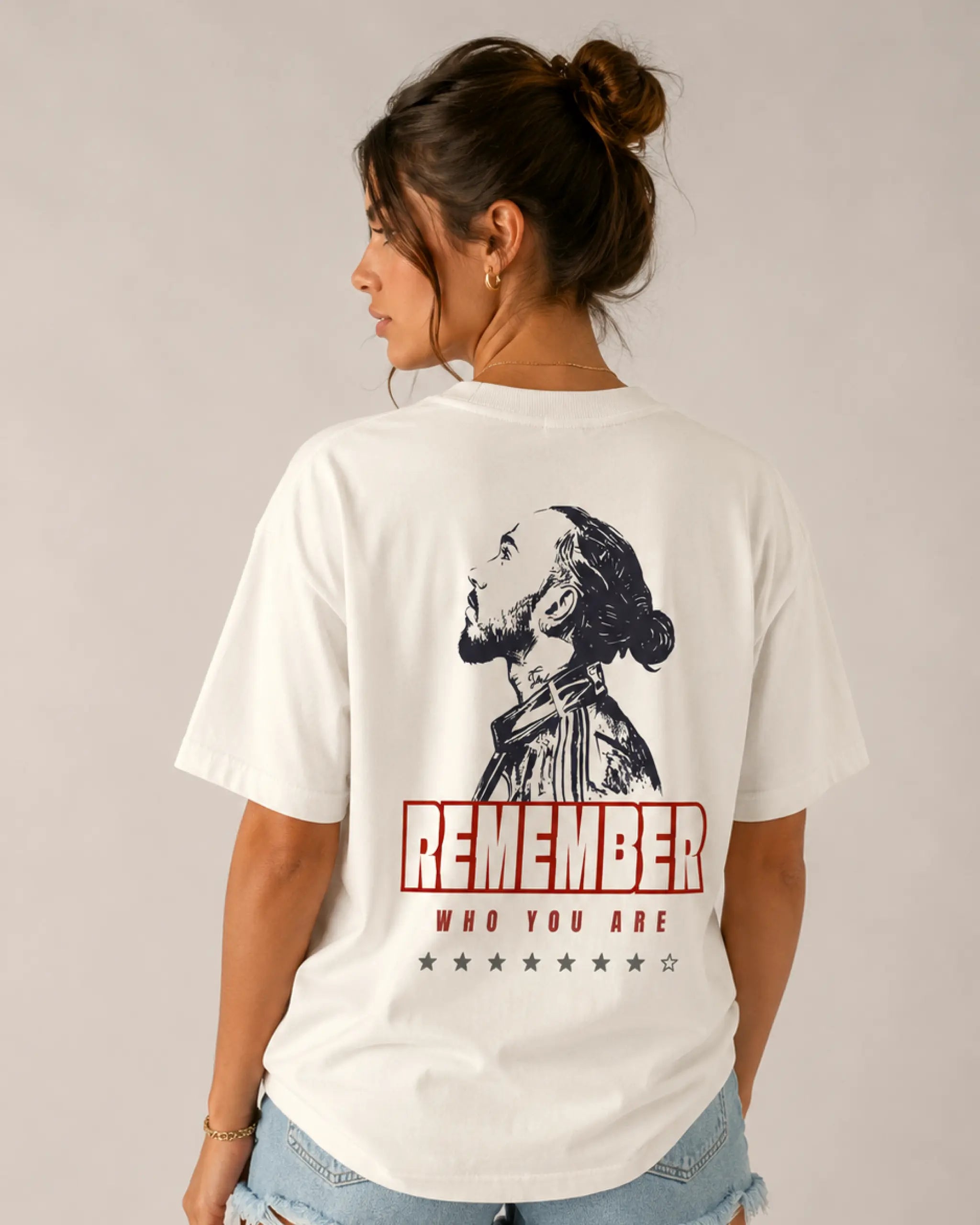 Female model woman wearing Lewis Hamilton Quote Remember Who You Are Fan Ferrari Graphic F1 Unisex Oversized T-shirt Off-White Back View | Turn1 India | Premium Cotton