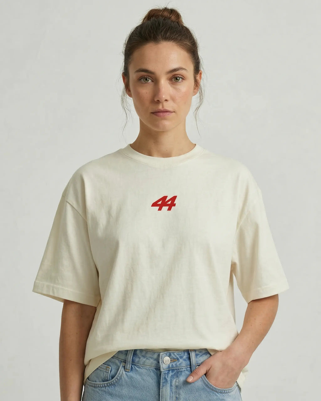 Female model wearing Lewis Hamilton Remember Who You Are Quote F1 Unisex Oversized T-shirt Off-White Front View | Turn1 India