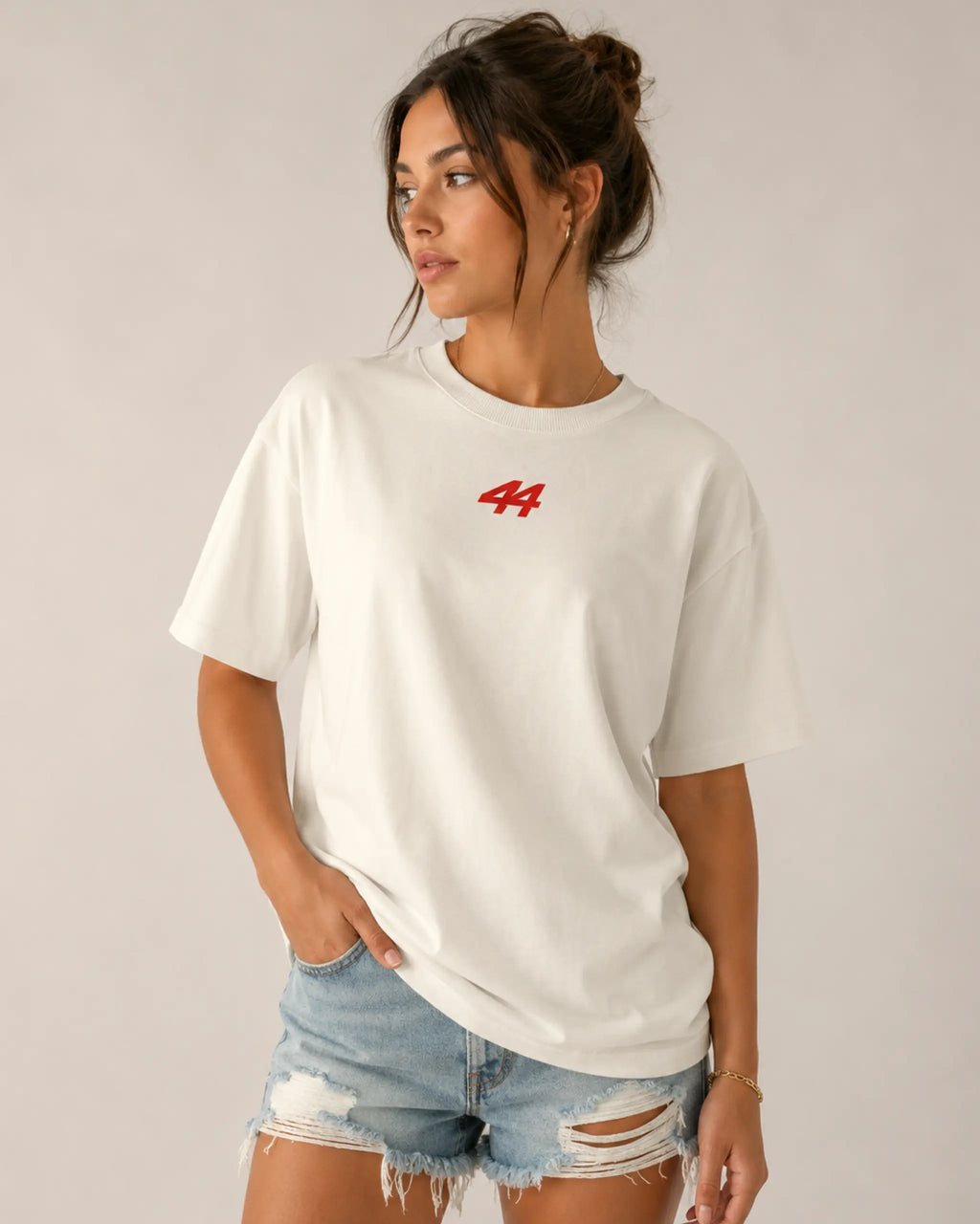 Female model woman wearing Lewis Hamilton Quote Remember Who You Are Fan Ferrari Graphic F1 Unisex Oversized T-shirt Off-White Front View | Turn1 India | Premium Cotton
