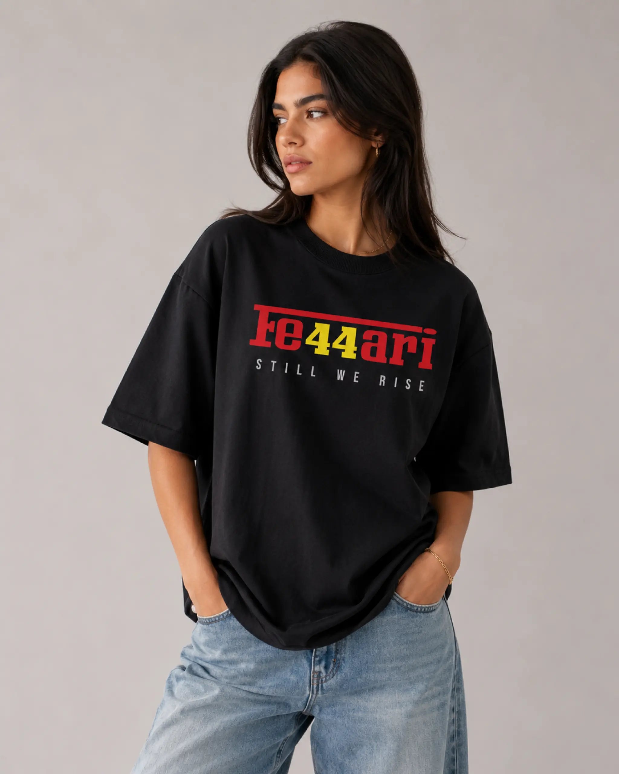 Female model woman wearing Ferrari F1 Unisex Oversized T-shirt Black | Turn1 India