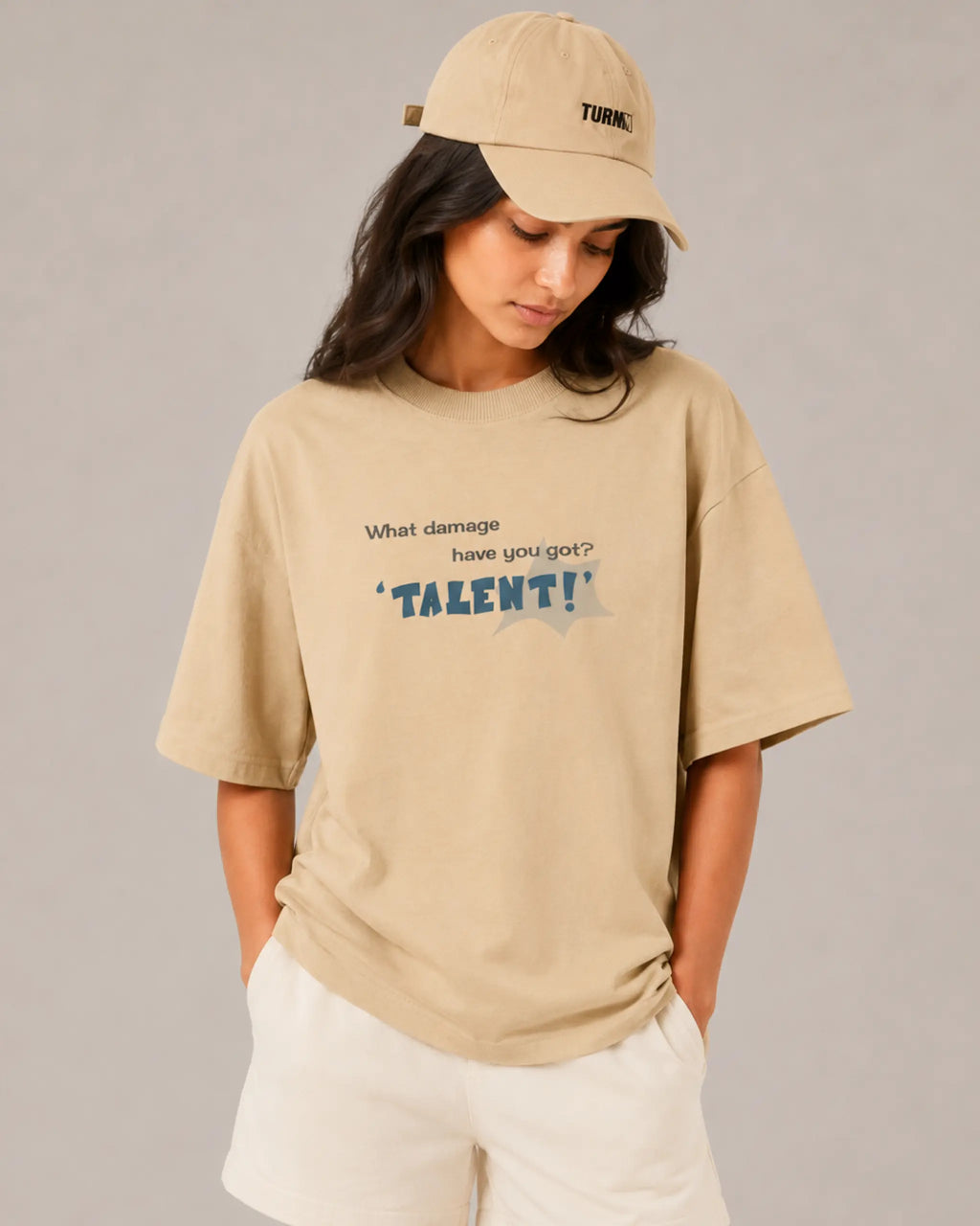 Female model woman wearing Lando Norris McLaren Talent Quote F1 Graphic T-shirt Beige Front View | Turn1 India