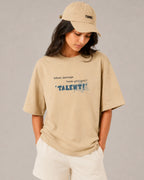 Female model woman wearing Lando Norris McLaren Talent Quote F1 Graphic T-shirt Beige Front View | Turn1 India