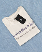 Folded Off-White British Grand Prix Graphic F1 t-shirt on light blue denim fabric background | Turn1 India