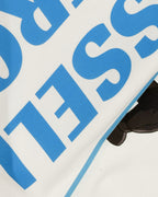 Closeup of cotton fabric and DTF print on Turn1 India F1 Tshirt Off White T-shirt: George Russell Energy front graphic with blue helmet and raised arms. Fan graphic of George Russell, driver of Mercedes AMG Petronas F1 Racing team.
Front print featuring George Russel's initials.