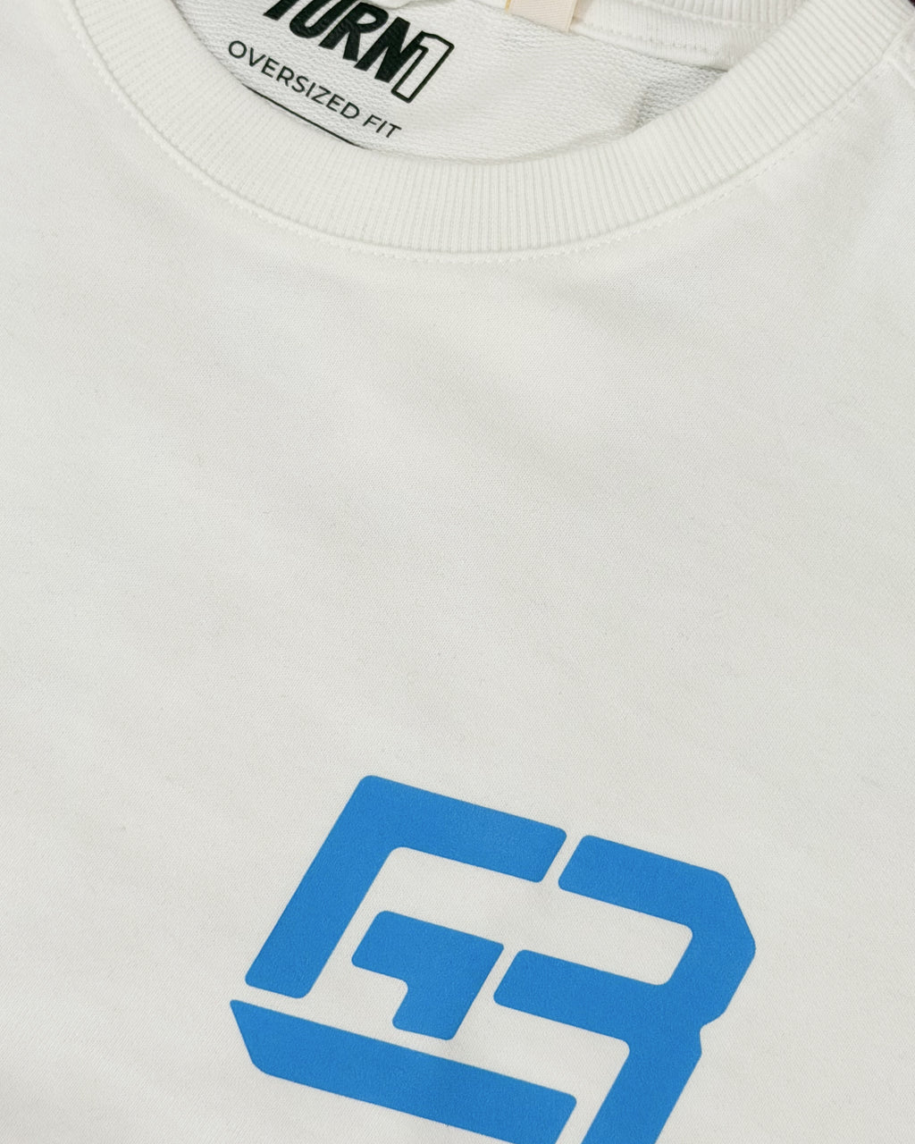 Closeup of cotton fabric and DTF print on Turn1 India F1 Tshirt Off White T-shirt: George Russell Energy front graphic with blue helmet and raised arms. Fan graphic of George Russell, driver of Mercedes AMG Petronas F1 Racing team.
Front print featuring George Russel's initials.