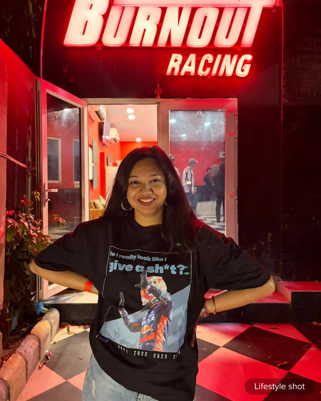 Girl Wearing Max Verstappen Attitude Don't Give a Sh*t F1 Unisex Oversized T-shirt Black Front View | Turn1 India