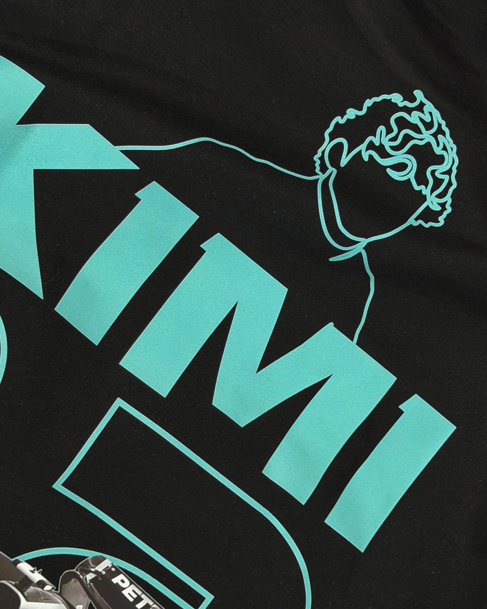 Closeup of F1 Turn1 India Black unisex oversized tshirt featuring Kimi Antonelli, Mercedes AMG Petronas F1 Team driver, his Mercedes F1 car and number 12.
Front print featuring text "Silver Arrows"