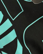 Closeup of F1 Turn1 India Black unisex oversized tshirt featuring Kimi Antonelli, Mercedes AMG Petronas F1 Team driver, his Mercedes F1 car and number 12.
Front print featuring text "Silver Arrows"