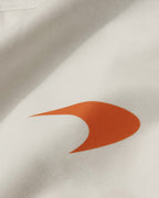 Close-up of Turn1 India Off White oversized unisex tshirt - fan graphic tee of Lando Norris, Mclaren Racing F1 driver. Tshirt's back print features Lando Norris, his helmet and text "2025 F1 World Champion".
Front print of tshirt features Mclaren Racing logo and Lando Norris' logo initials