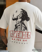 Lifestyle image of man wearing Lewis Hamilton Remember Who You Are F1 Unisex Oversized T-shirt Off-White Back View | Turn1 India