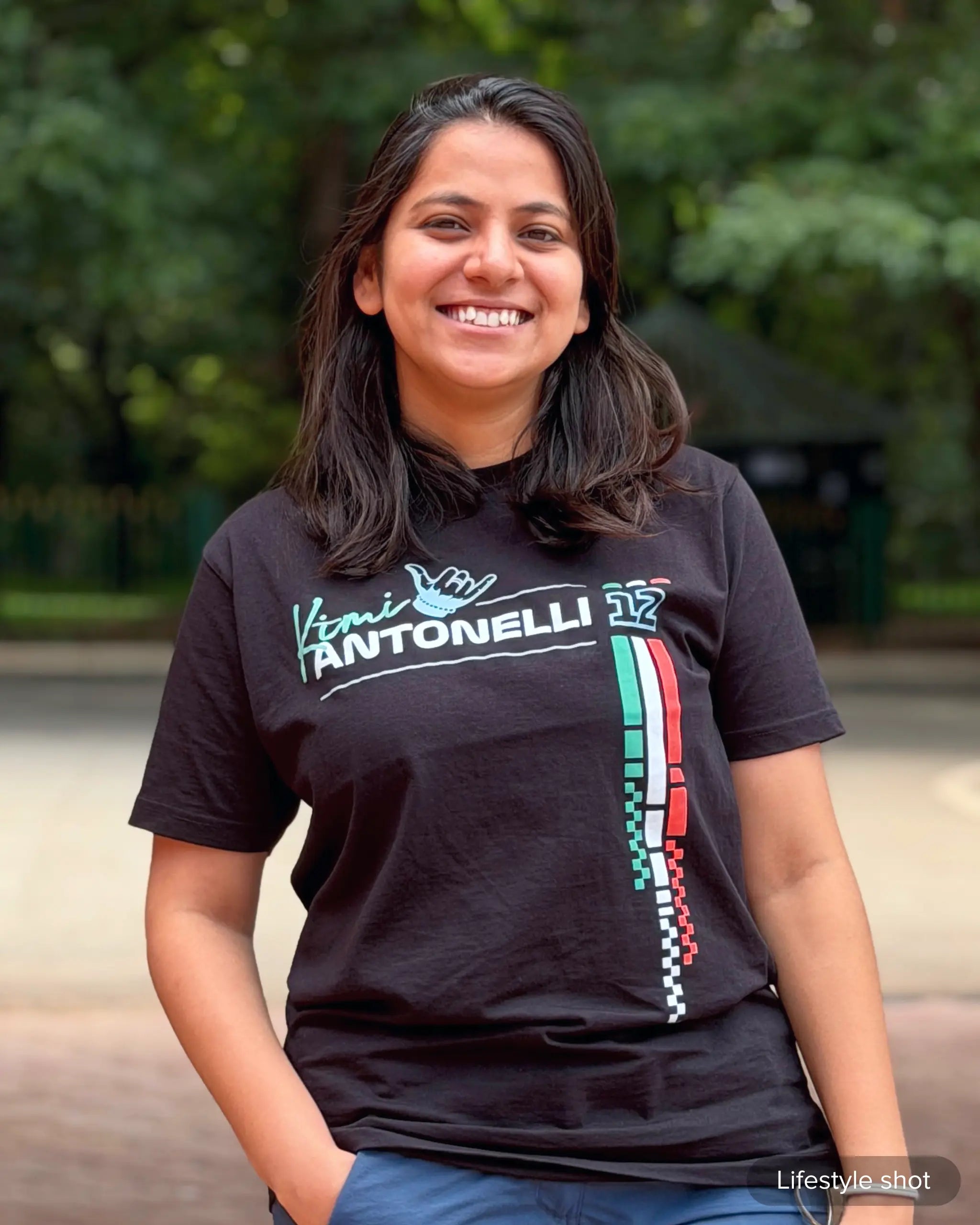 Lifestyle image of woman wearing Kimi Antonelli Signature F1 Unisex Regular Fit T-shirt Black Front View | Turn1 India
