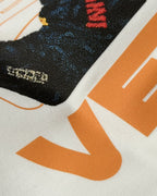 Close-up of large orange “VERSTAPPEN” text on F1 Off White Unisex Oversized fit T-shirt by Turn 1 Brand, an F1 Apparel brand of India. Max Verrstappen fan tshirt with back print features Max Verstappen fan graphic and his name "Verstappen" in bold orange font. Frontprint features Redbull Racing F1 team logo and Max's number 3.