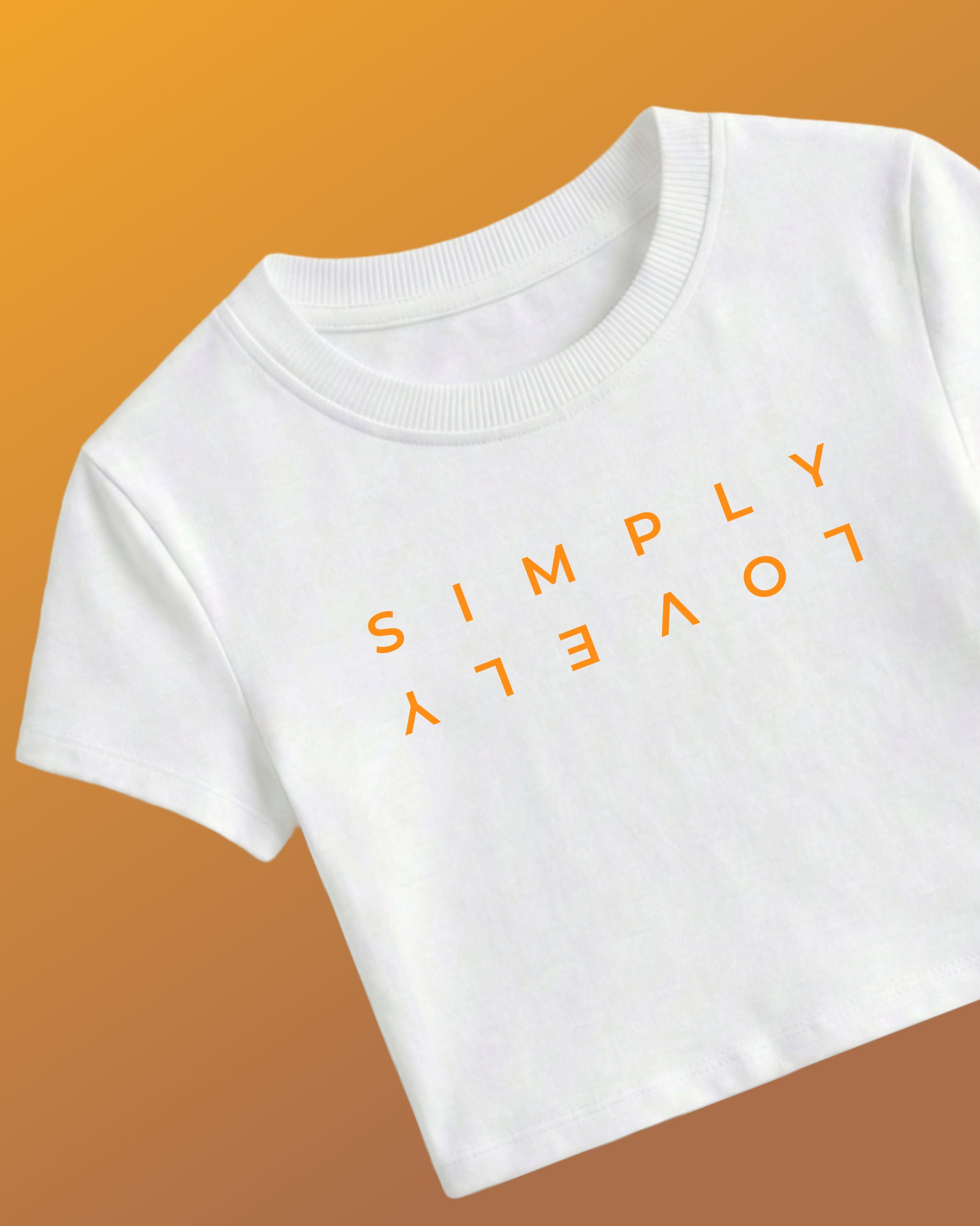 F1 White Women Crop Top by Turn 1 Brand, an F1 Apparel brand of India. Max Verrstappen fan crop top with quote "Simply Lovely" in orange font.