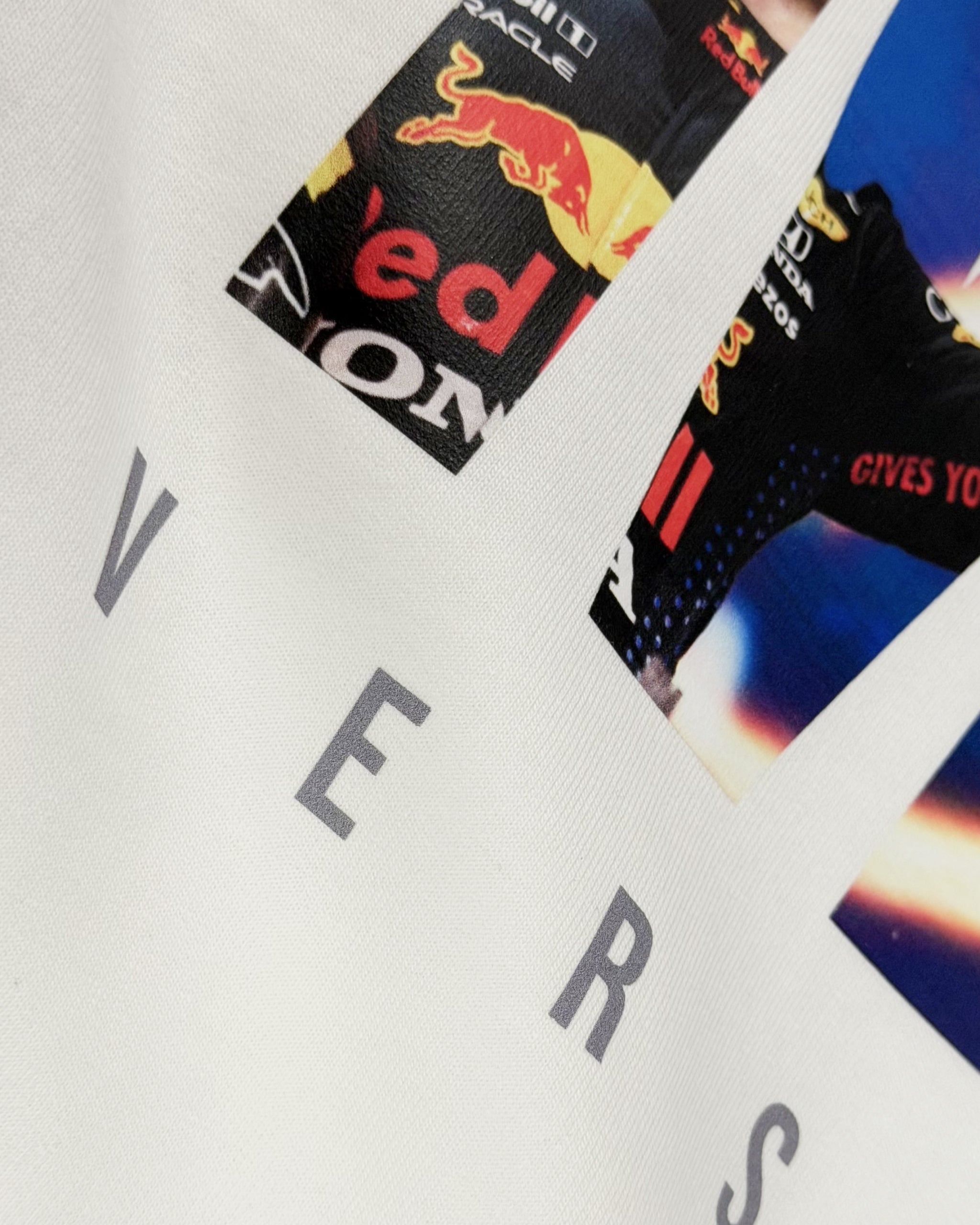 Closeup image of cotton fabric for F1 Turn1 India Off White Oversized Unisex Tshirt featuring fan graphic Max Verstappen, driver for Redbull Racing F1 team and his various iconic race moments