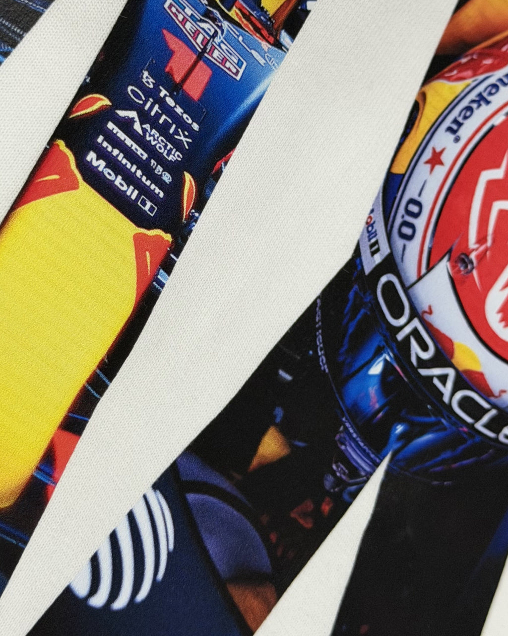 Closeup image of cotton fabric and premium print of F1 Turn1 India Off White Oversized Unisex Tshirt featuring fan graphic Max Verstappen, driver for Redbull Racing F1 team and his various iconic race moments