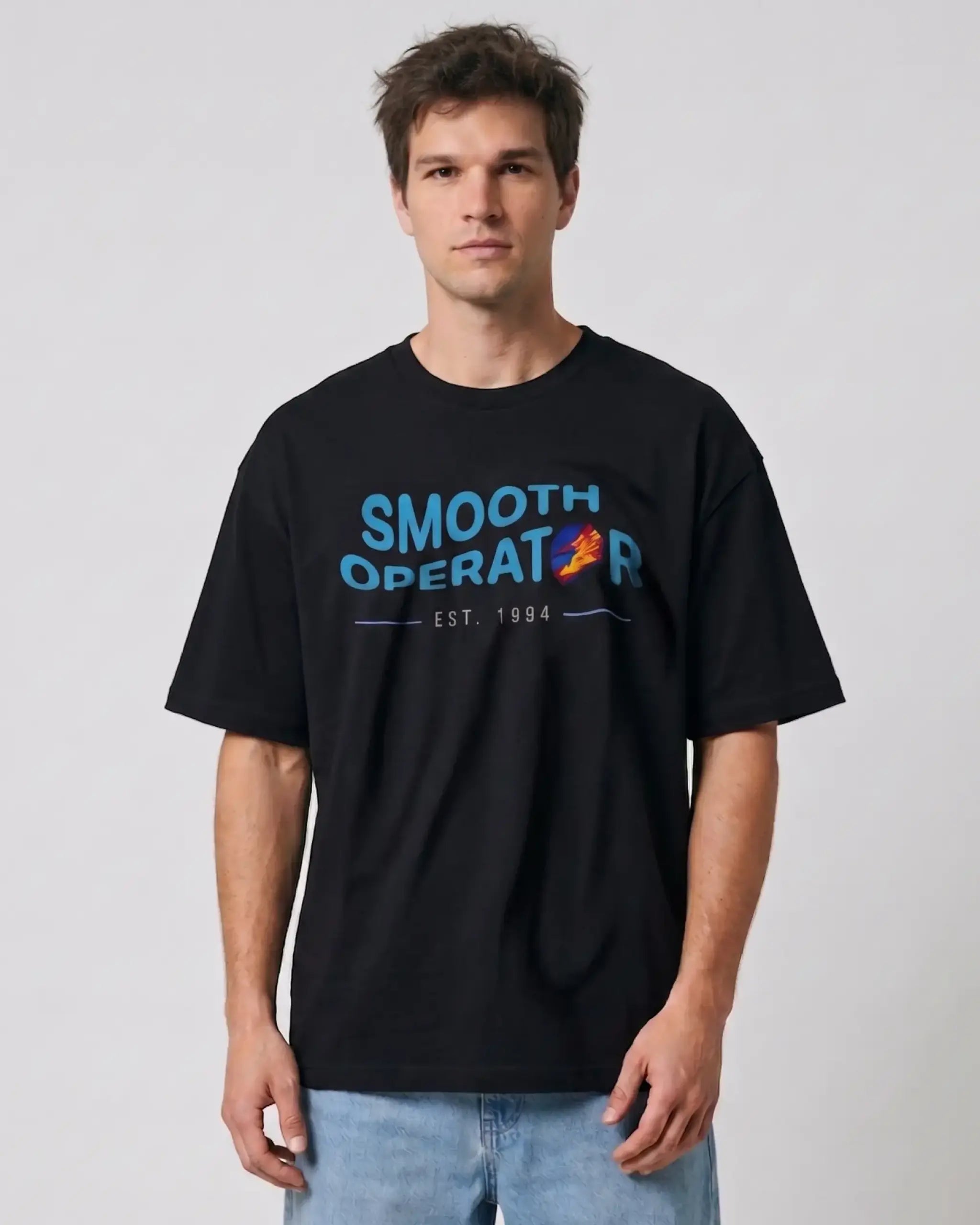 Male Model wearing Carlos_Sainz Smooth Operator F1 Unisex Oversized T-shirt Black Front View | Turn1 India