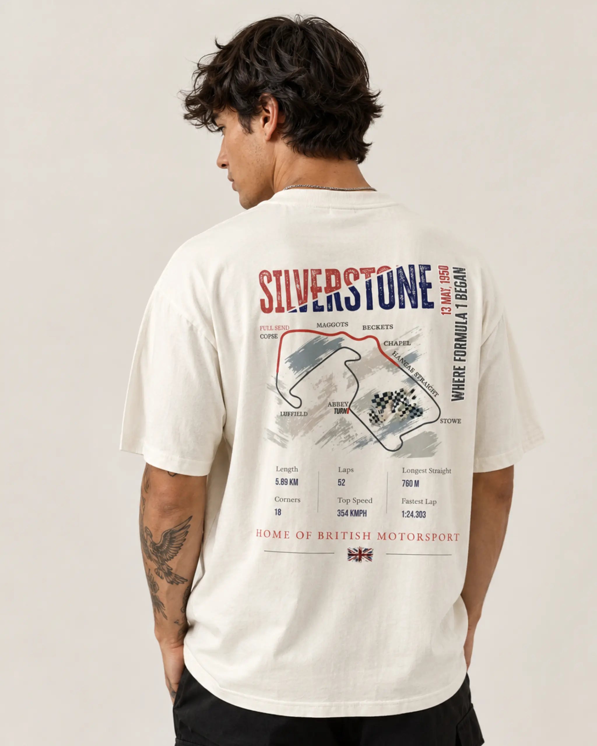 Male model man wearing British Grand Prix Silverstone F1 Unisex Oversized T-shirt Off-White Back View | Turn1 India