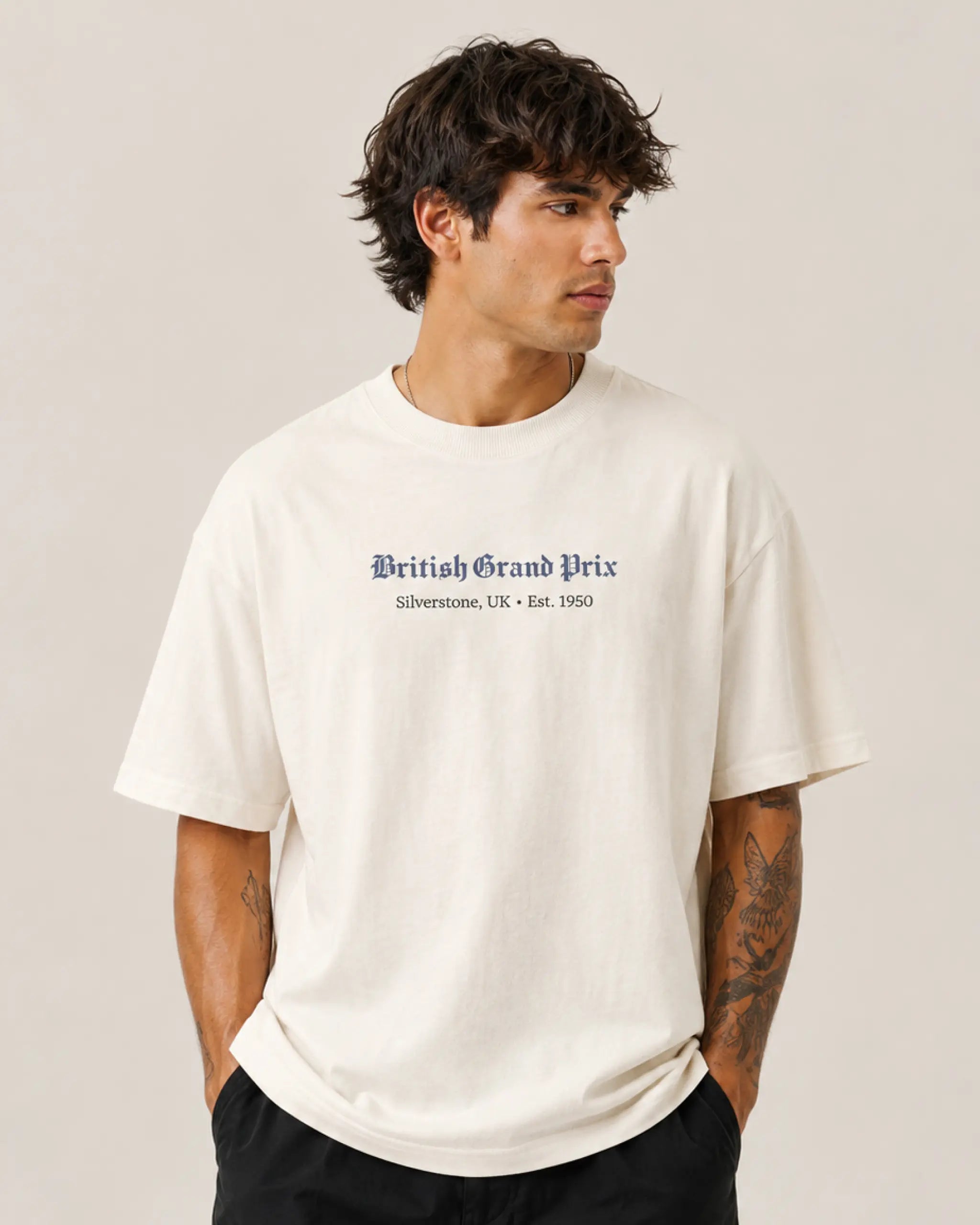Male model man wearing British Grand Prix Silverstone F1 Unisex Oversized T-shirt Off-White Front View | Turn1 India