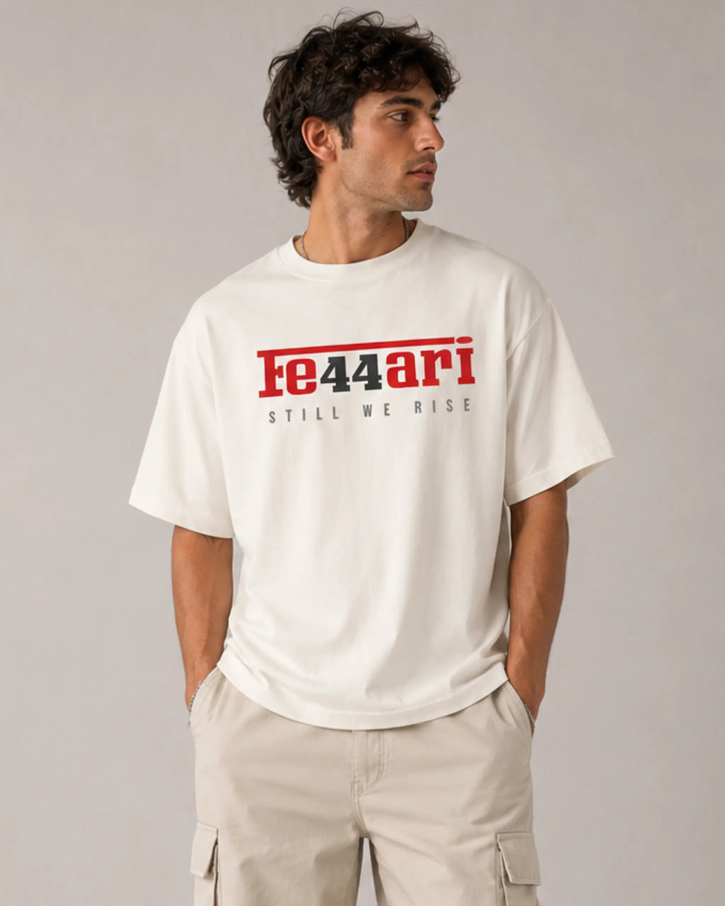 Male model man wearing Lewis Hamilton Ferrari 44 Still We Rise F1 Unisex Oversized T-shirt Off-White Front View | Turn1 India