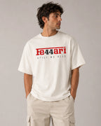 Male model man wearing Lewis Hamilton Ferrari 44 Still We Rise F1 Unisex Oversized T-shirt Off-White Front View | Turn1 India