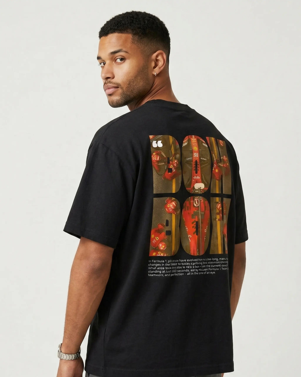 Male model wearing Box Box Pit Stop Formula 1 F1 Oversized Unisex T-shirt Black Back View | Turn1 India