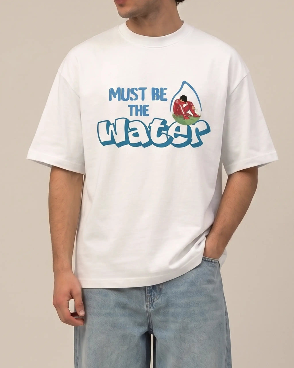 Male model wearing Charles Leclerc Ferrari Must Be The Water F1 Unisex Oversized T-shirt Off-White Front View | Turn1 India