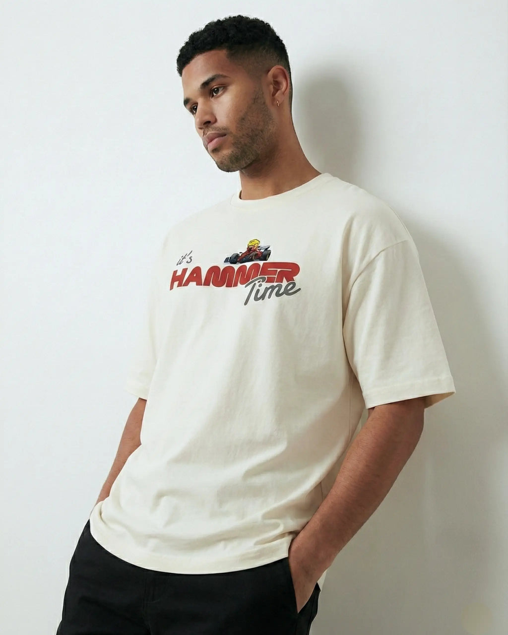 Male model wearing Lewis Hamilton It's Hammertime F1 Unisex Oversized T-shirt Off-White Front View | Turn1 India