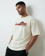 Male model wearing Lewis Hamilton It's Hammertime F1 Unisex Oversized T-shirt Off-White Front View | Turn1 India