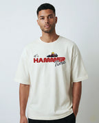 Male model wearing Lewis Hamilton It's Hammertime F1 Unisex Oversized T-shirt Off-White Front View | Turn1 India
