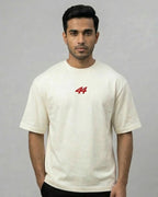 Male model wearing Lewis Hamilton Remember Who You Are Quote F1 Unisex Oversized T-shirt Off-White Front View | Turn1 India